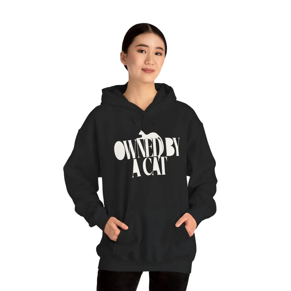 Model wearing the Owned by a cat hoodie in Black