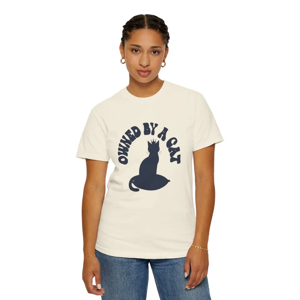Model wearing the Owned by a cat crown tee in Bone
