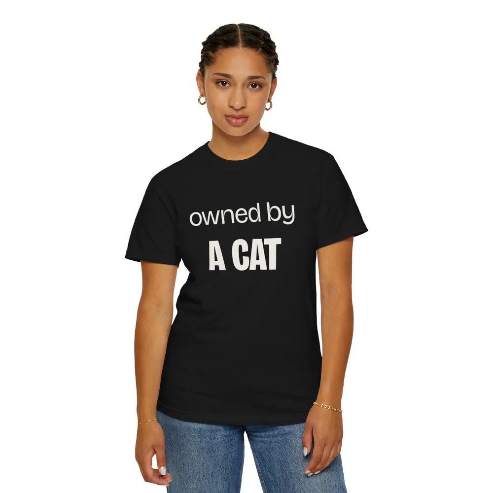 Model wearing the Owned by a cat lettering tee in Black